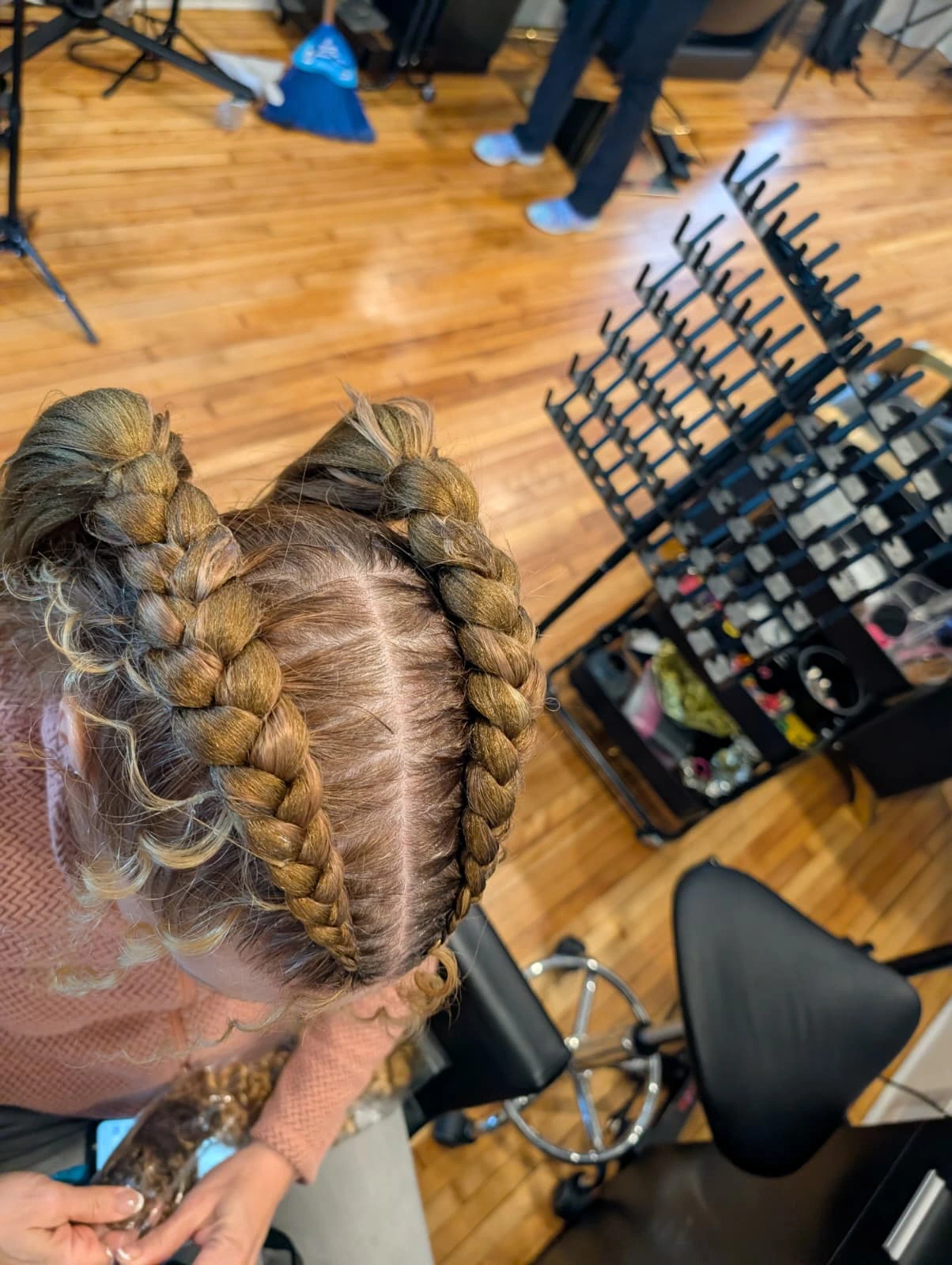 Overhead view of two large, neat Dutch braids with extensions, a beautiful tension-free style for Afro and textured hair.
