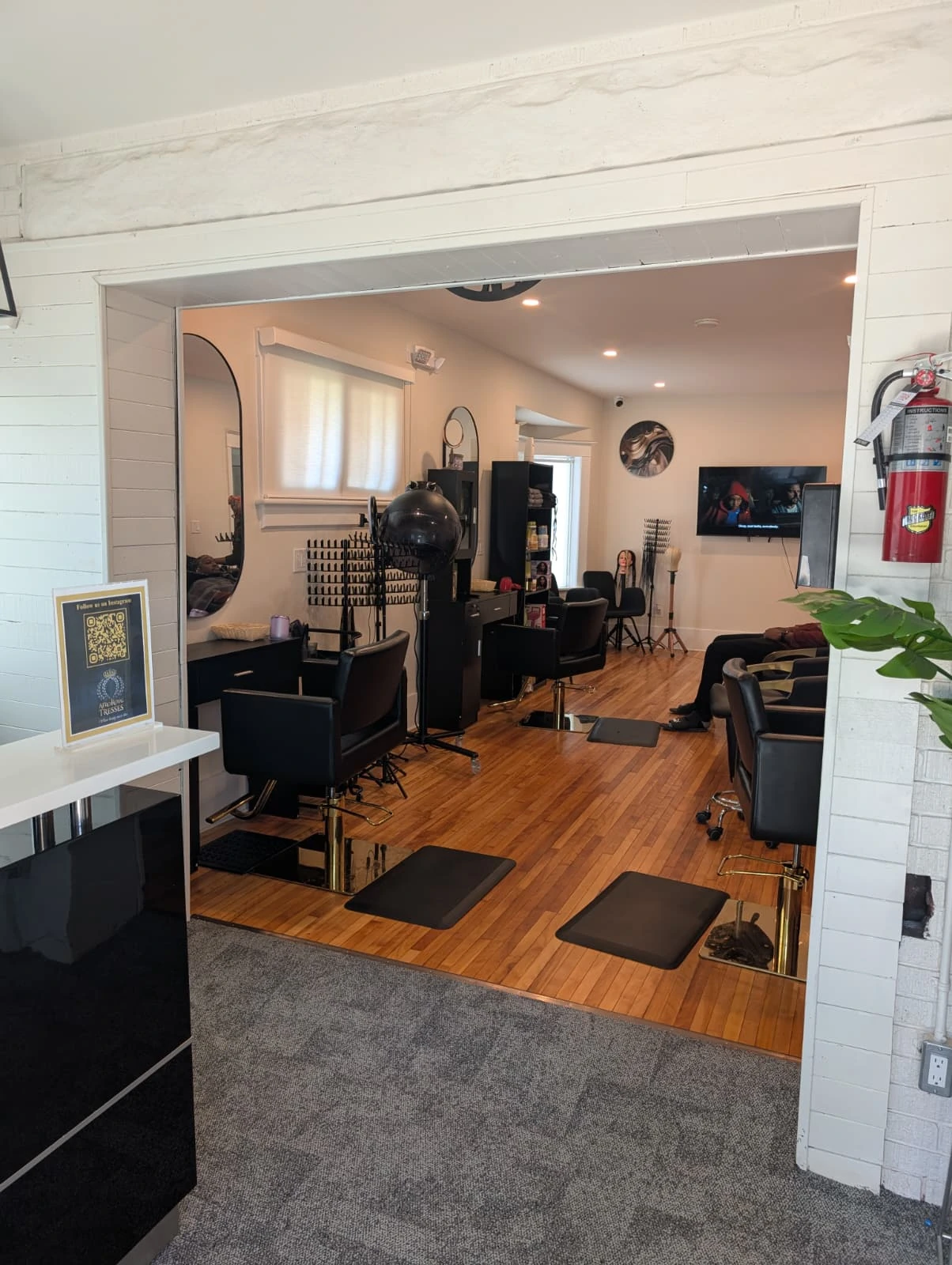A complimentary coffee and water station for clients to enjoy during their visit to our upscale Afro-centric hair salon in Kitchener.