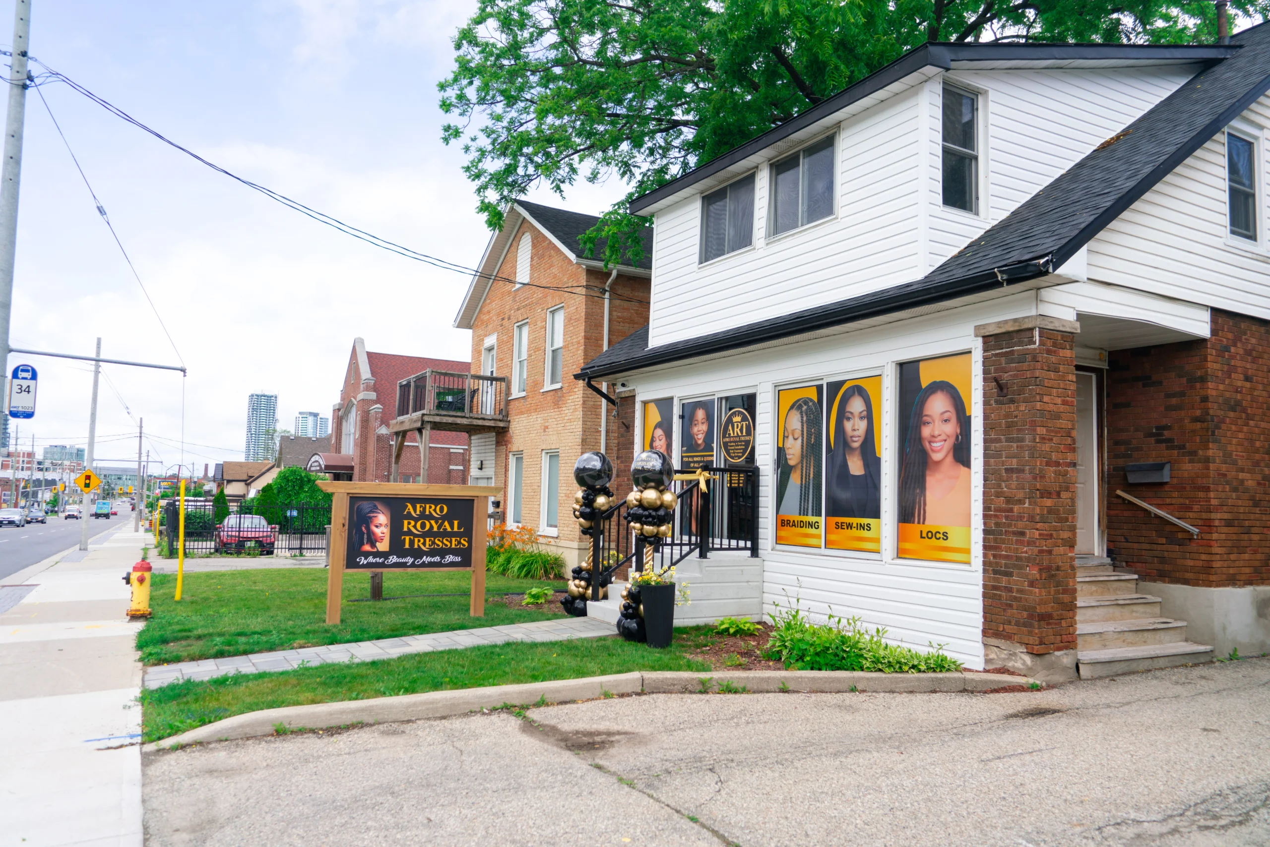 Exterior side view of the Afro Royal Tresses salon building in Kitchener, highlighting its convenient location for clients seeking expert textured hair care.